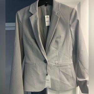 Little wrinkly but never worn. Brand new